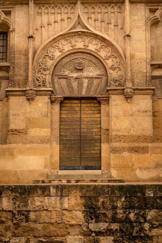 Intricate stonework entrance of cathedral in Córdoba, Spain.
